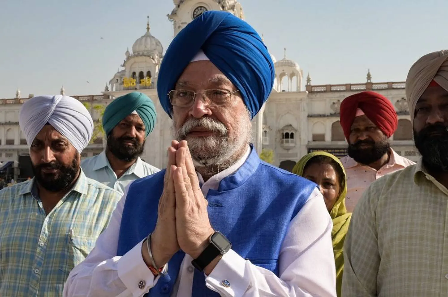 Minister of Petroleum and Natural Gas Hardeep Singh Puri (C) gestures during his visit at the Golden temple in Amritsar on May 15, 2023. (AFP) 