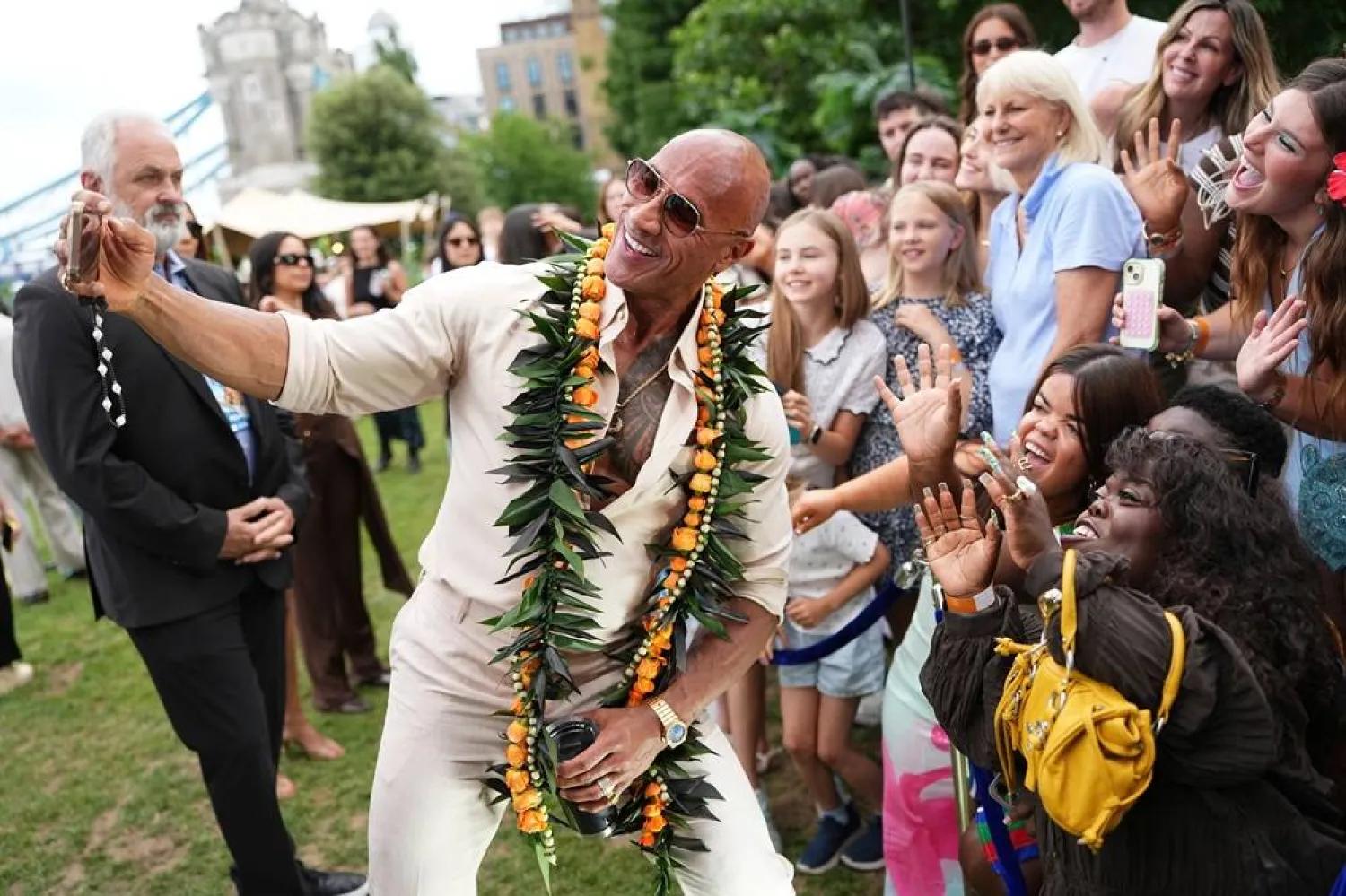  Dwayne Johnson poses for photographs with fans at the "Moana" experience in London, Tuesday, June 30, 2026. (AP) 