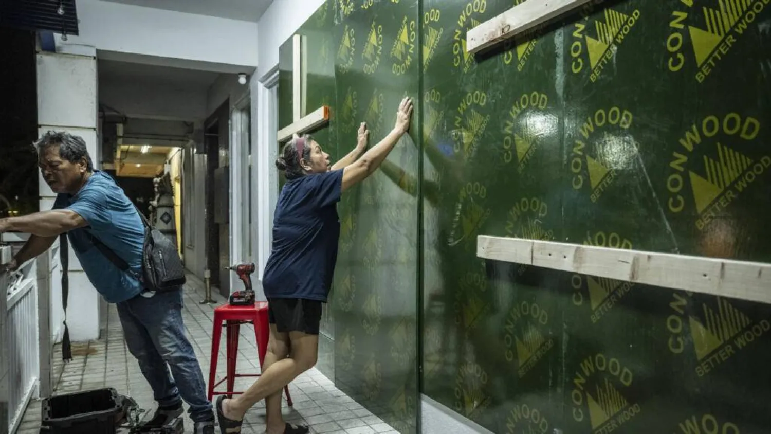 People in Guam and the Northern Marianas moved to emergency evacuation centers and made last-minute preparations hours before Super Typhoon Bavi was projected to bulldoze through the US Pacific territories. Yuichi YAMAZAKI / AFP
