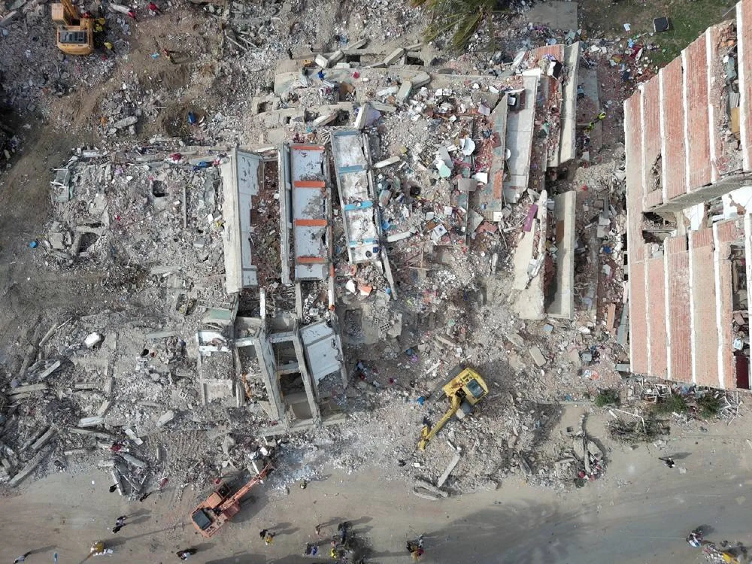  A drone view shows heavy machinery being used at the site of a damaged buildings in the aftermath of the June 24 earthquakes, in La Guaira, Venezuela, July 4, 2026. (Reuters)
