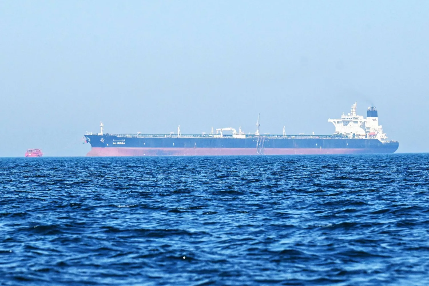 The "Al-Riqqa" oil tanker sails in the Arabian Gulf waters, off the coast of  Kuwait City on June 27, 2026. (AFP)