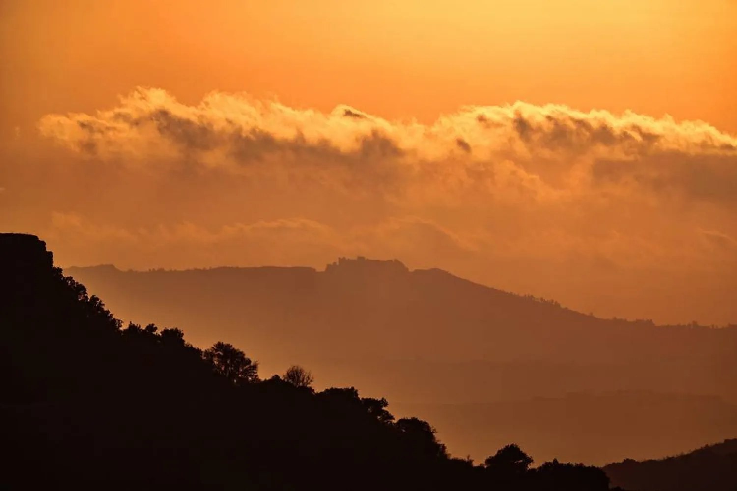 The Crusader-period Beaufort Castle (rear) in southern Lebanon at sunset, as seen from the Upper Galilee in northern Israel, 29 June 2026, amid a ceasefire between Israel and Lebanon. (EPA)