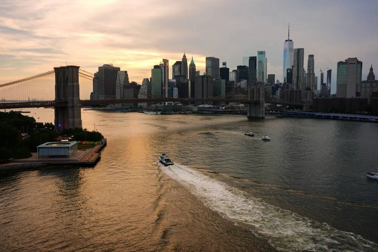 Boats sail on the East River by the Brooklyn Bridge, as the United States celebrates its 250th anniversary on Independence Day, in New York City, US, July 4, 2026. (Reuters) 