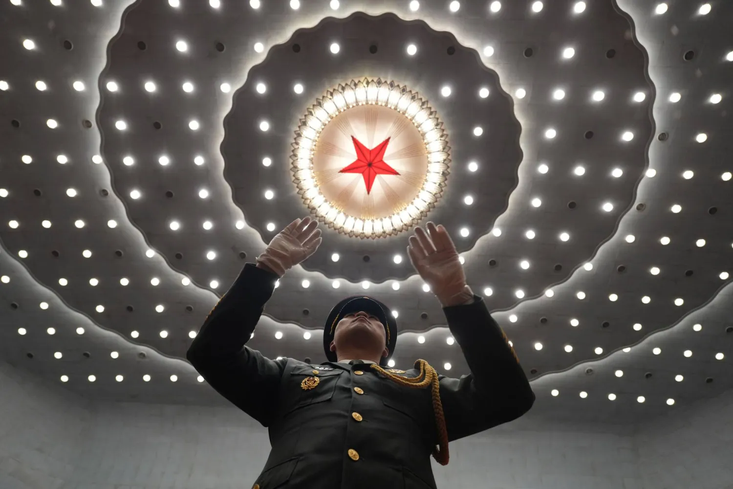 A military band conductor leads during a ceremony to mark the 105th anniversary of the founding of the Chinese Communist Party at the Great Hall of the People in Beijing, Wednesday, July 1, 2026. (AP Photo/Ng Han Guan)