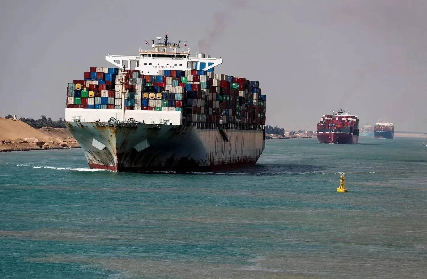 Shipping containers pass through the Suez Canal in Suez, Egypt (Reuters) 