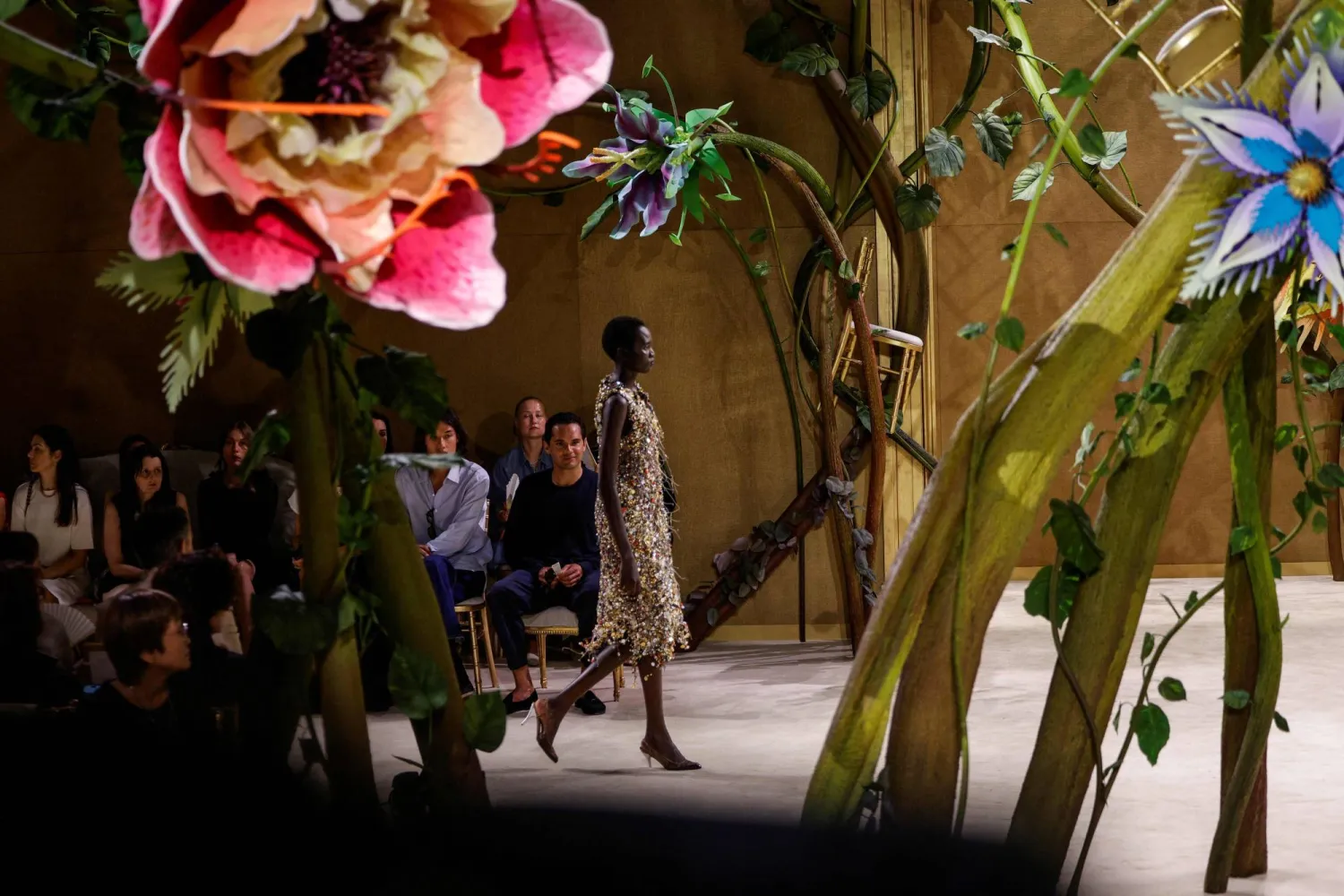 A model presents a creation for Chanel for the Women Haute Couture Fall/Winter 2026-2027 collection as part of the Paris Fashion Week, in Paris, on July 7, 2026. (AFP)