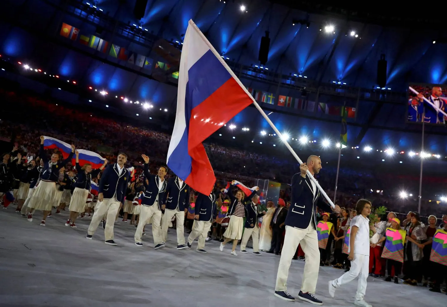 Rio Olympics - Opening ceremony - Maracana - Rio de Janeiro, Brazil - 05/08/2016. Flagbearer Sergey Tetyukhin (RUS) of Russia arrives for the opening ceremony. (Reuters)
