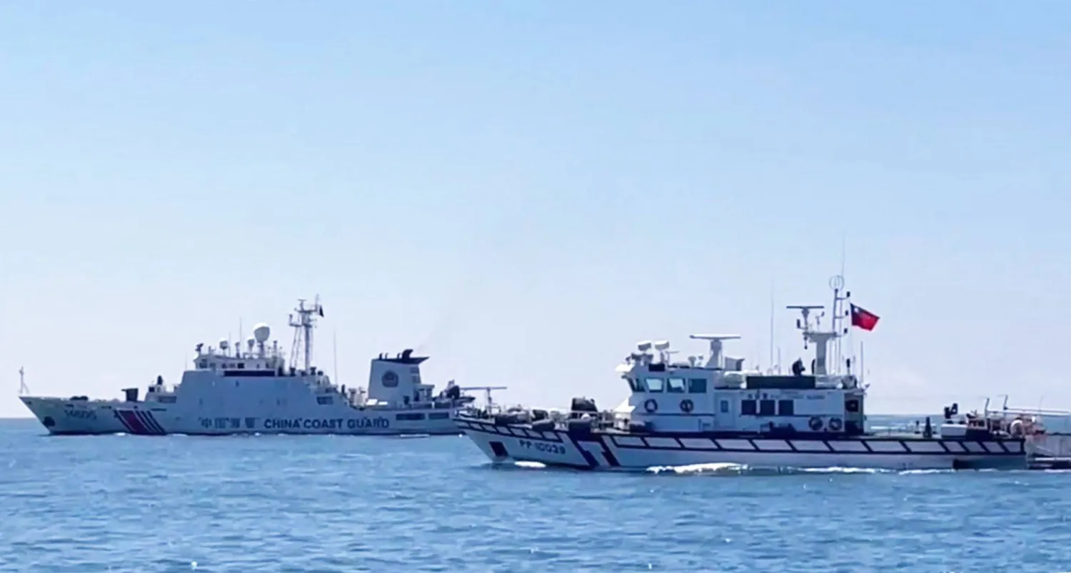 A handout photo from Taiwan Coast Guard taken and released on July 8, 2026 shows a Taiwan Coast Guard patrol vessel (R) sailing near a China Coast Guard ship in waters south of Kinmen, in Kinmen, Taiwan. (Handout / Taiwan Coast Guard / AFP)