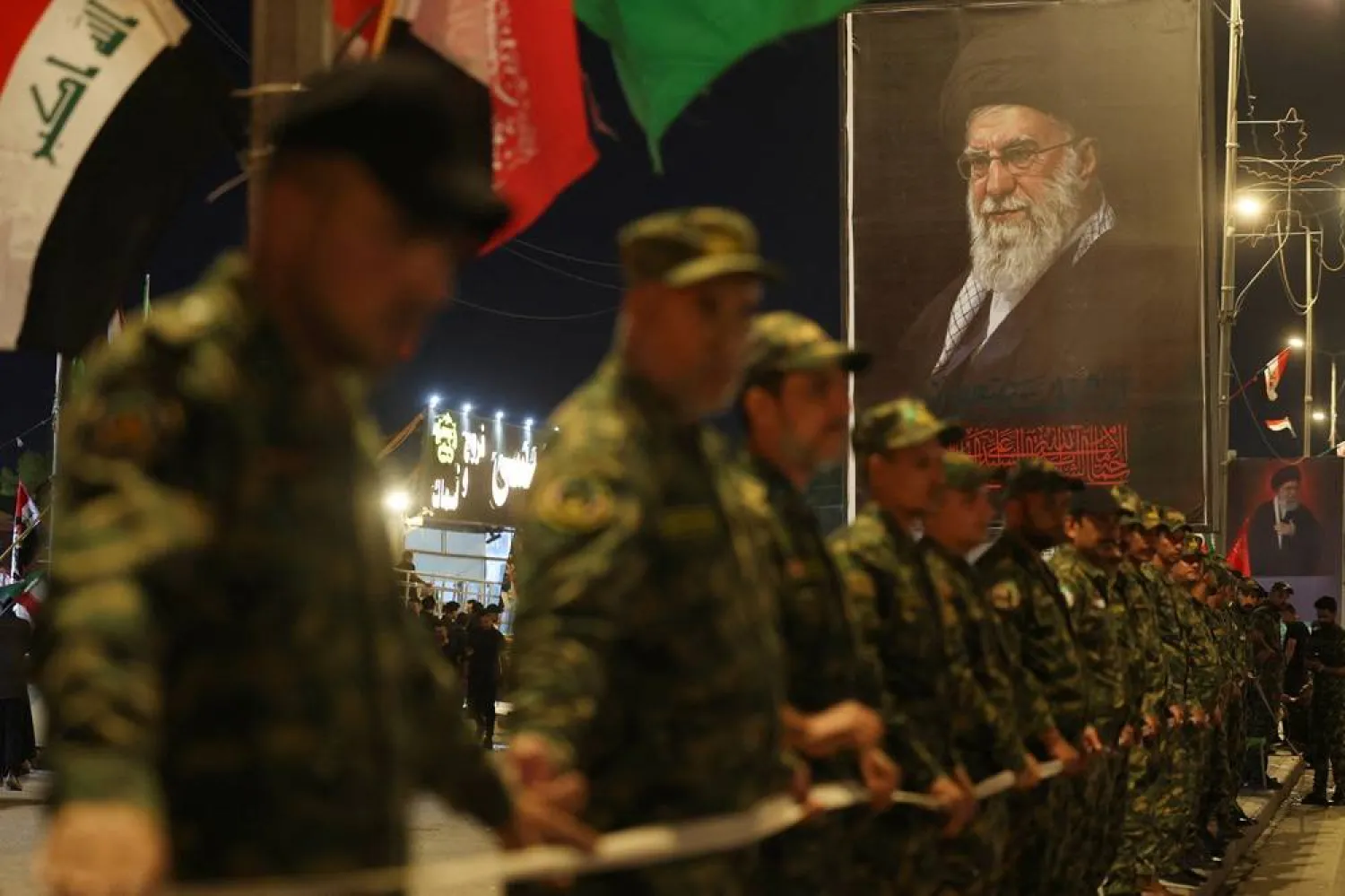 Security personnel stand guard on the day of a funeral procession for Iran's late Supreme Leader Ali Khamenei, who was killed on February 28 in Israeli and US airstrikes, in Najaf, Iraq, July 8, 2026. (Reuters)