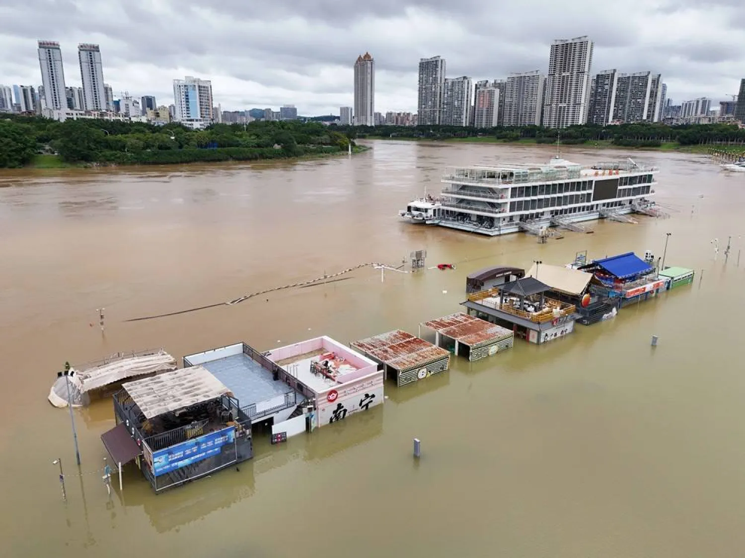 A riverside park is seen inundated by the surging flood brought by Typhoon Maysak in Nanning in southern China's Guangxi Zhuang Autonomous Region, 07 July 2026. (EPA)