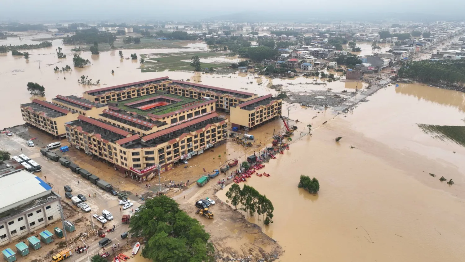 A drone view shows rescue workers conducting relief operations in flood-affected Maling town, after the Liulan reservoir dam breach, following heavy rainfall brought by typhoon Maysak, in Hengzhou, Guangxi Zhuang Autonomous Region, China, July 8, 2026. China Daily via REUTERS 