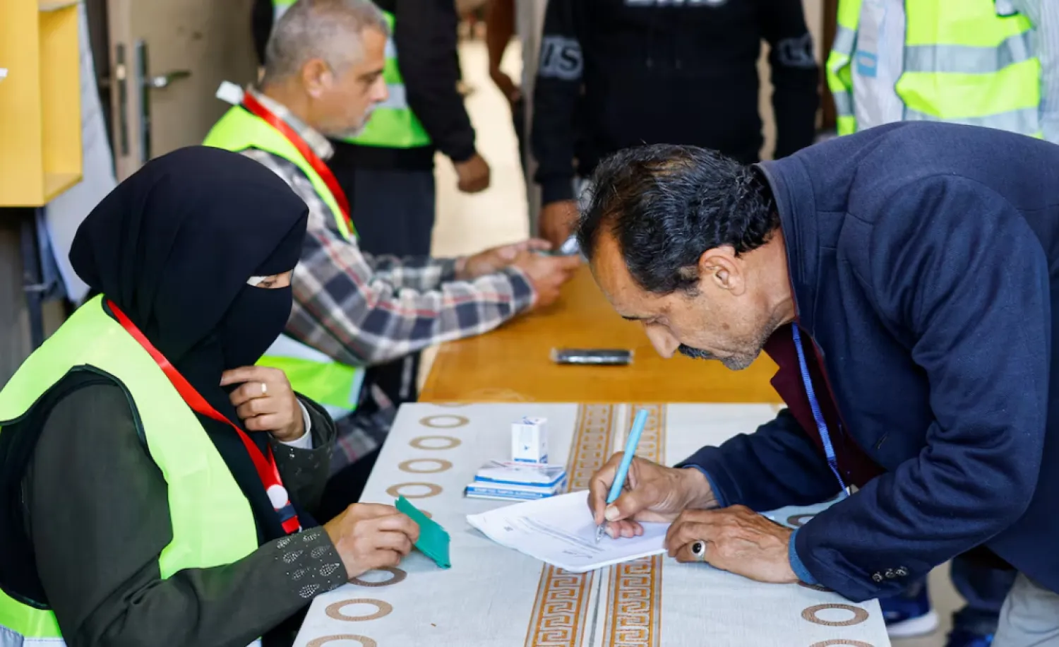 A Palestinian man votes during the municipal election at a polling station in Deir al-Balah, central Gaza Strip April 25, 2026. REUTERS/Mahmoud Issa