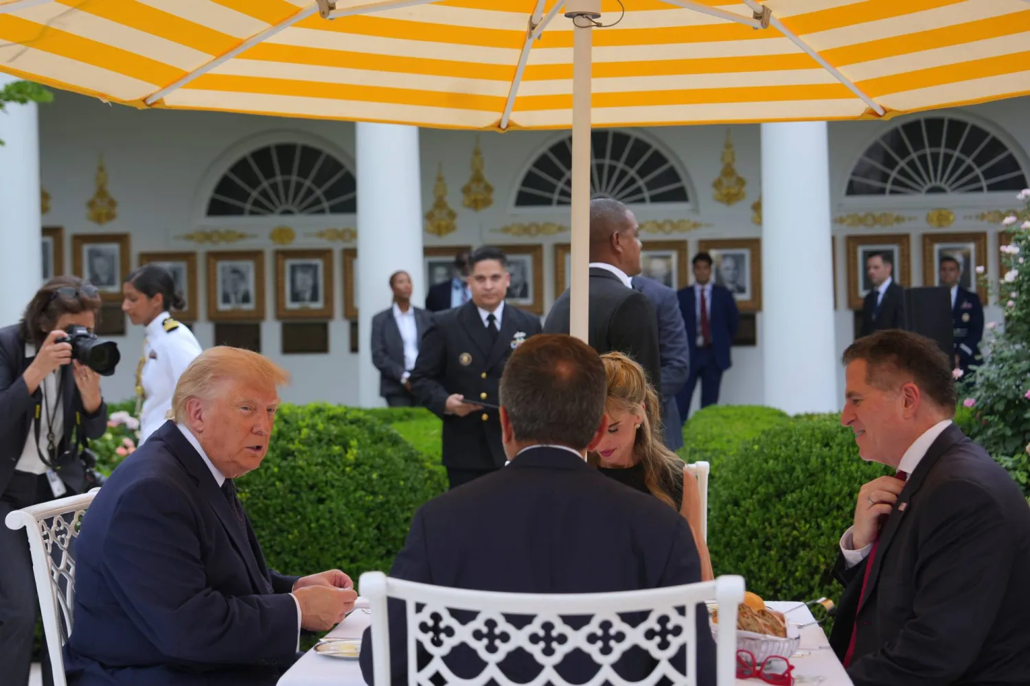 President Donald Trump, from left, sits at a lunch with Susan Dell and Dell CEO Michael Dell, in the White House Rose Garden, Monday, July 6, 2026, in Washington. (AP Photo/Julia Demaree Nikhinson)