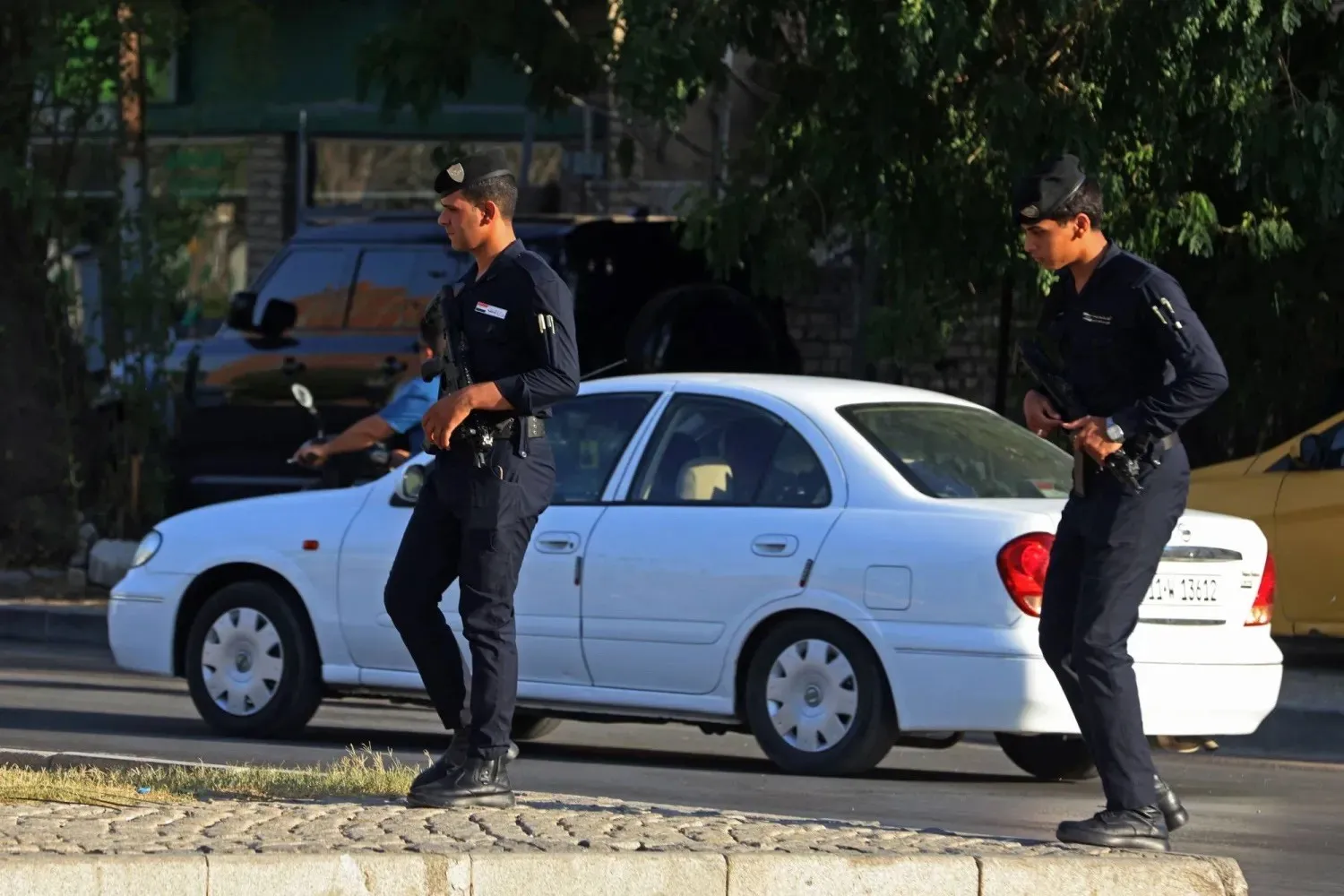 Iraqi security personnel patrol a street in Baghdad on June 28. (AFP) 