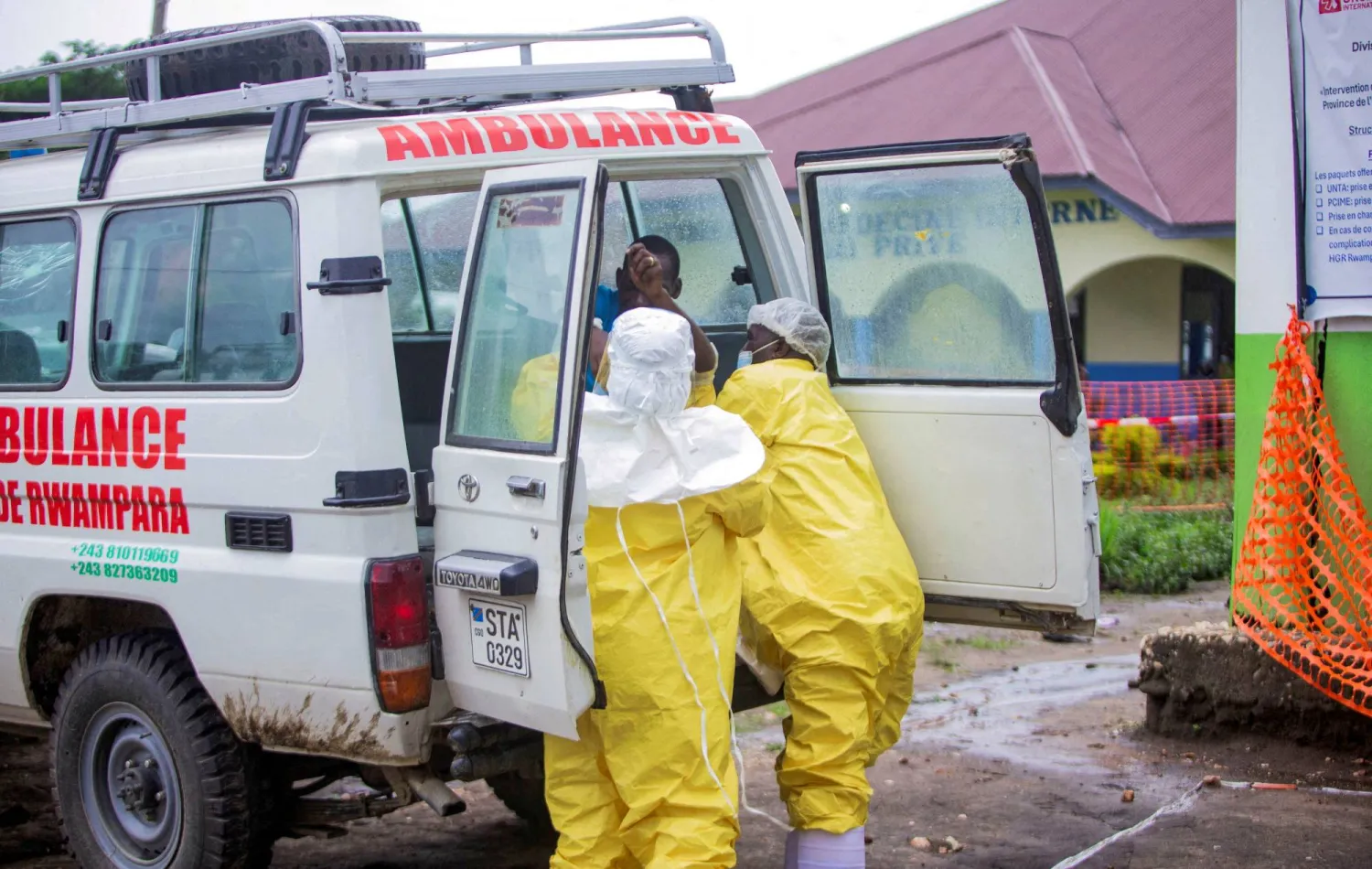 FILE PHOTO: Congolese health workers receive a patient at the Rwampara General Hospital as authorities intensify efforts to contain a new Ebola outbreak involving the Bundibugyo strain outbreak in Rwampara outside Bunia, Ituri province, Democratic Republic of Congo, May 21, 2026. REUTERS/Stringer//File Photo