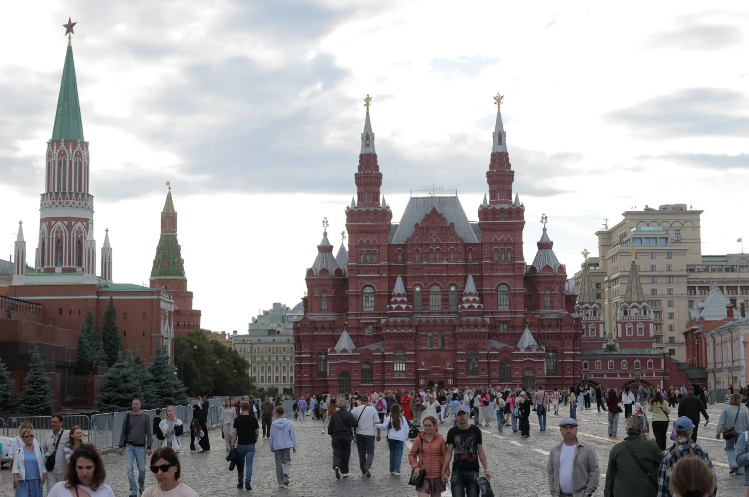 People walk on the Red Square outside the Kremlin on a summer day in downtown Moscow, Russia, 26 June 2026.  EPA/MAXIM SHIPENKOV