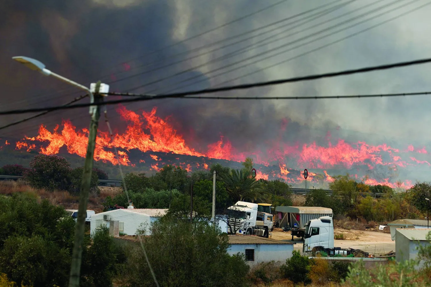 A wildfire burns in Los Gallardos, Almeria, Spain, July 10, 2026. REUTERS/Violeta Santos Moura