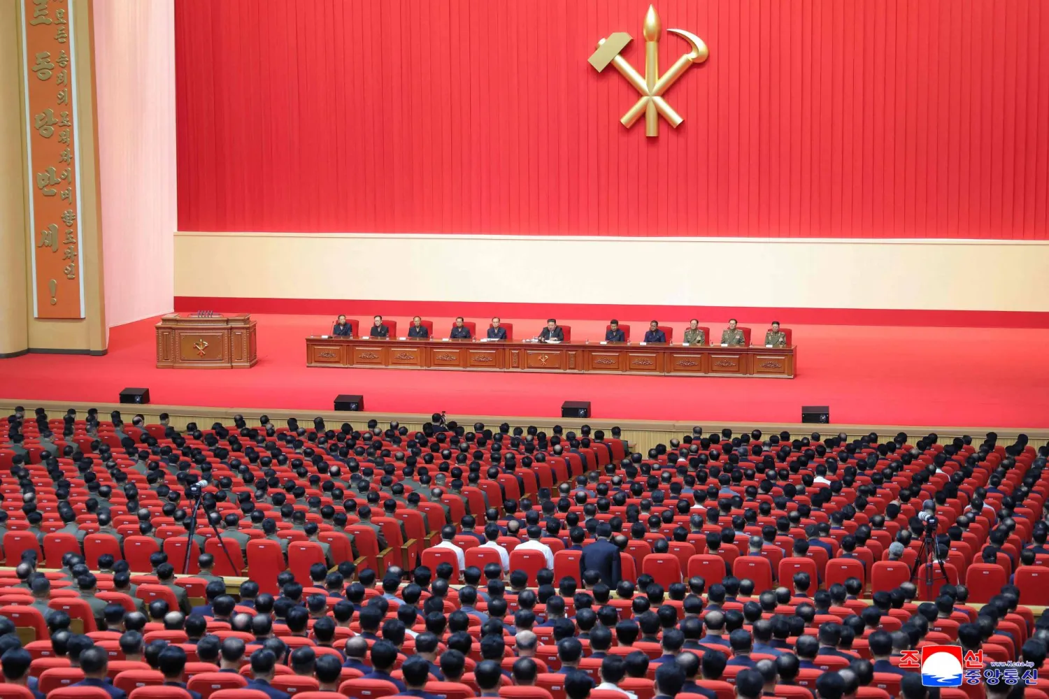 This picture taken on July 10, 2026 and released by North Korea's official Korean Central News Agency (KCNA) on July 11, 2026 shows North Korean leader Kim Jong Un (C) attending a joint meeting of party, government and army of North Korea at the April 25 House of Culture in Pyongyang. (KCNA via KNS / AFP)