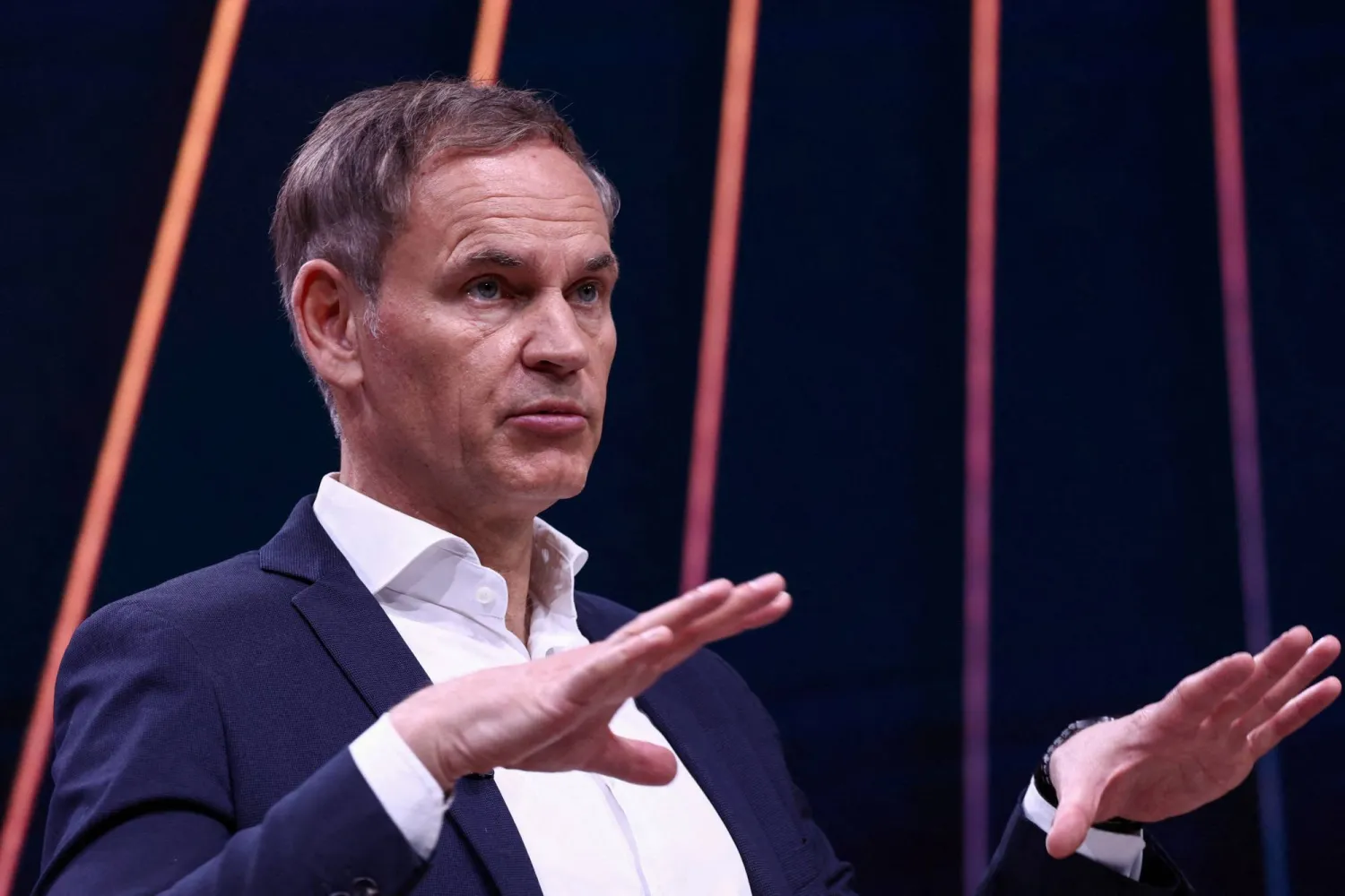 FILE PHOTO: Oliver Blume, CEO of Volkswagen AG and Porsche AG, speaks during the annual Volkswagen Group press conference in Wolfsburg, Germany March 11, 2025. REUTERS/Liesa Johannssen/File Photo