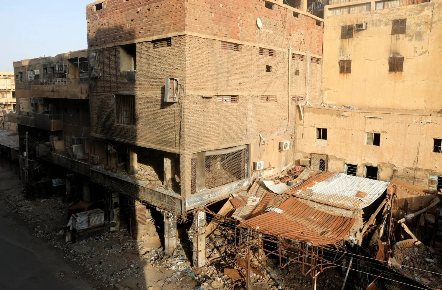 Burnt shops lies down closed in downtown in Khartoum, Sudan June 25, 2026. REUTERS/El Tayeb Siddig