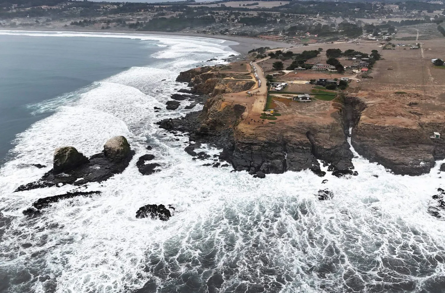 This aerial view shows Punta de Lobos beach in the coastal city of Pichilemu, O'Higgins Region, Chile, on July 8, 2026. (Photo by Rodrigo ARANGUA / AFP)