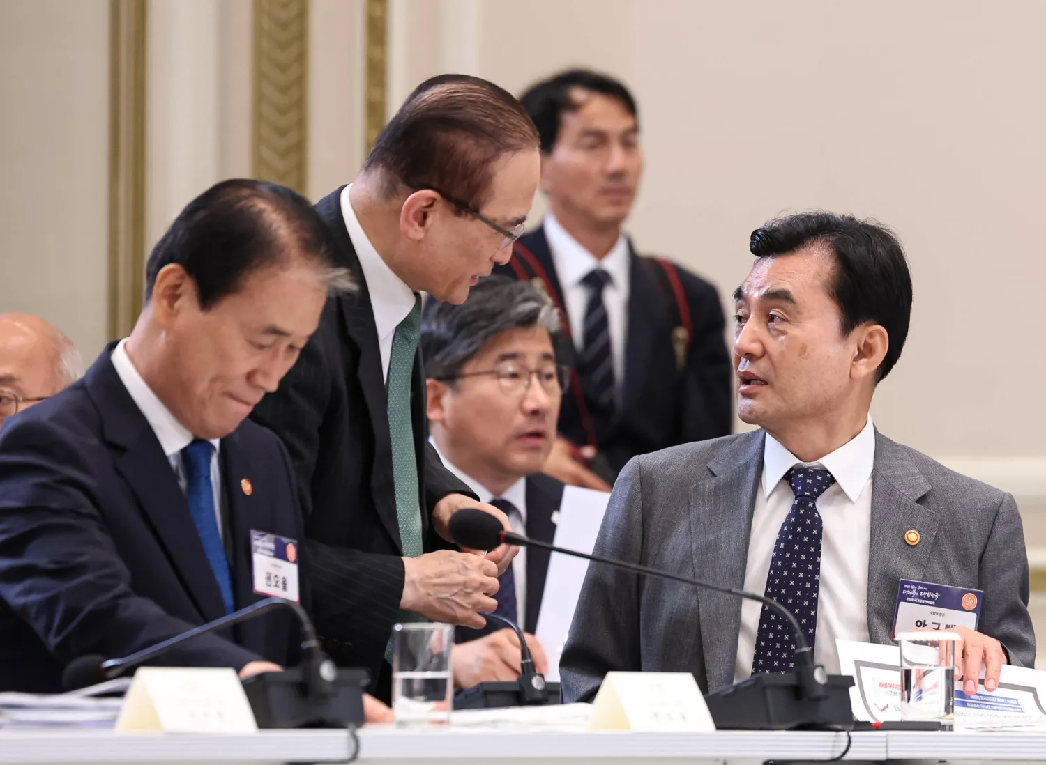 South Korean Defense Minister Ahn Gyu-back (R) talks with National Security Adviser Wi Sung-lac (C) during the National Fiscal Strategy Meeting, chaired by South Korean President Lee Jae Myung, at the presidential office Cheong Wa Dae in Seoul, South Korea, 13 July 2026.  EPA/YONHAP
