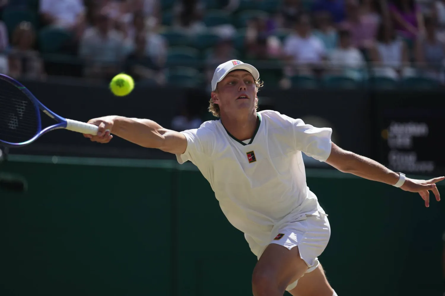 Cruz Hewitt of Australia returns the ball to Jordan Lee of the United States in the boy's singles final at the Wimbledon Tennis Championships in London, Sunday, July 12, 2026. (AP Photo/Brian Inganga) 