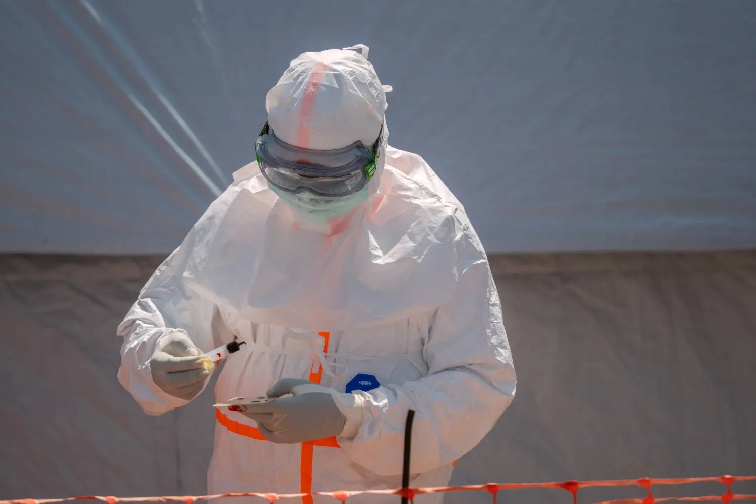 FILE - A health worker prepares a patient's blood sample for testing at Bunia General Hospital in Bunia, Congo, Thursday, June 11, 2026. (AP Photo/Moses Sawasawa, File)