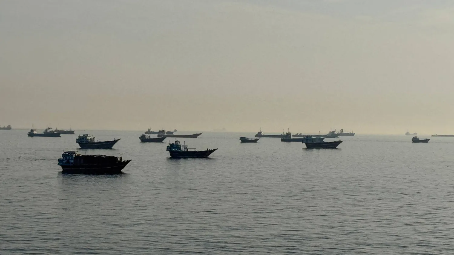 Ships anchored near the Strait of Hormuz await passage (AFP)