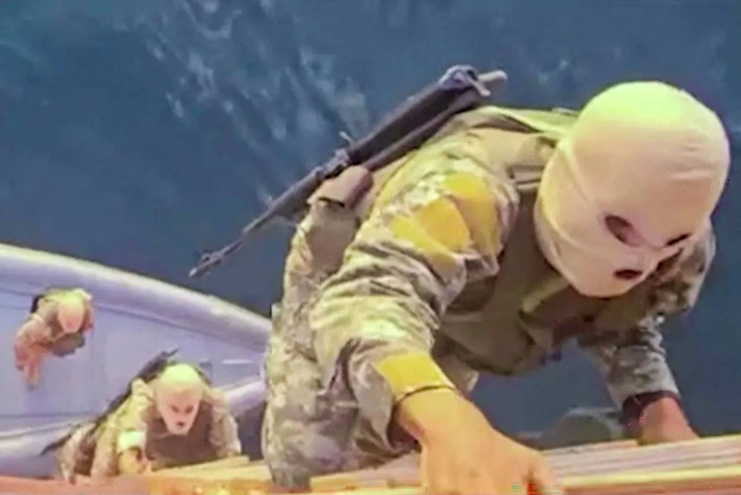 This screen grab taken from undated video footage released by Iran's Revolutionary Guards (IRGC) and made available via Iran's state broadcaster (IRIB) on April 23, 2026, shows IRGC naval forces allegedly boarding a ship attempting to cross the Strait of Hormuz. (Photo by IRIB TV / AFP) /