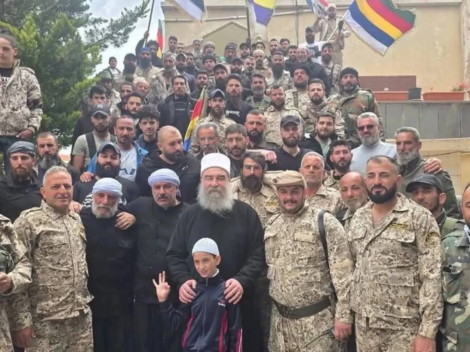 Sheikh Hikmat al-Hijri, flanked by supporters from the so-called National Guard. (Suwayda24) 