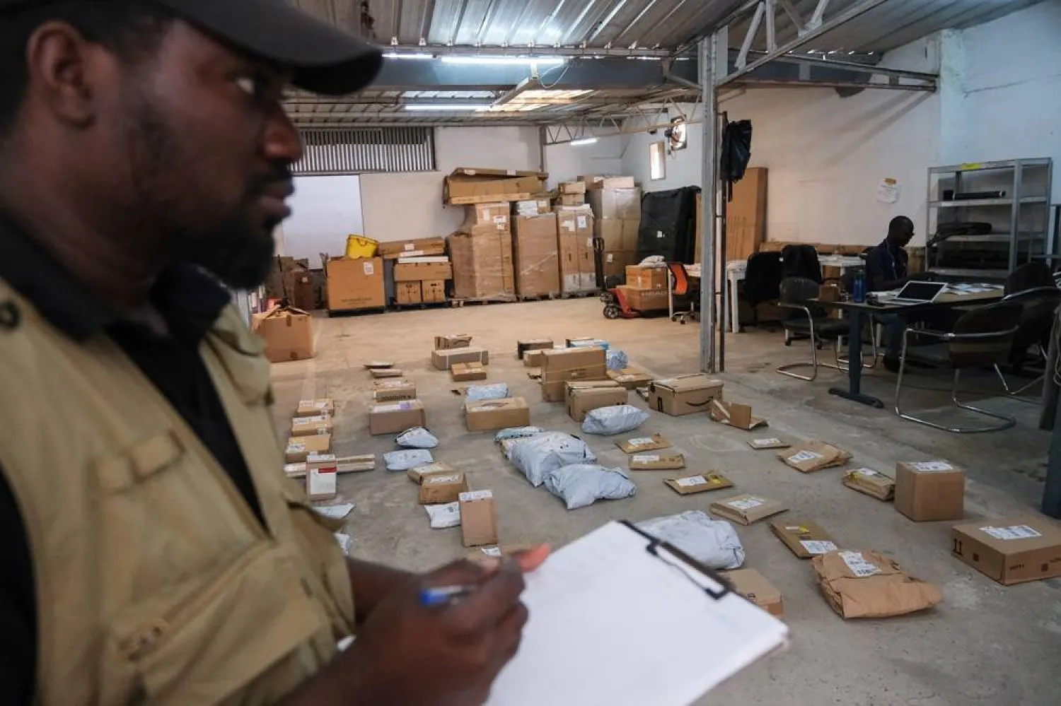 Djima Antaley organizes packages at Afrety headquarters in Dakar, Senegal, May 20, 2026. (Reuters) 