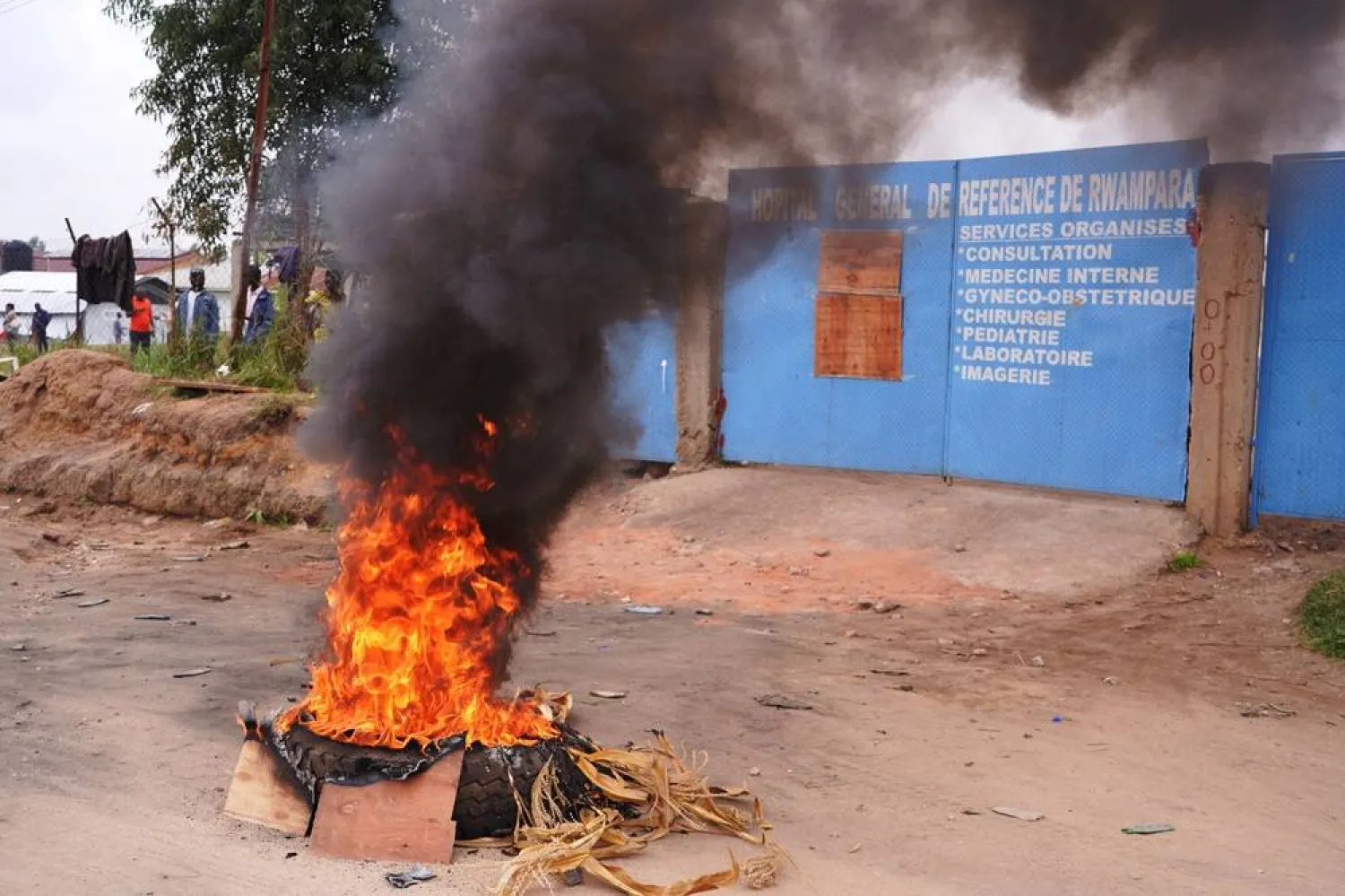 A tire burns outside the Ebola Treatment Center at Rwampara General Hospital during a strike by medical staff in Rwampara, Ituri, Democratic Republic of Congo, 13 July 2026. (EPA)