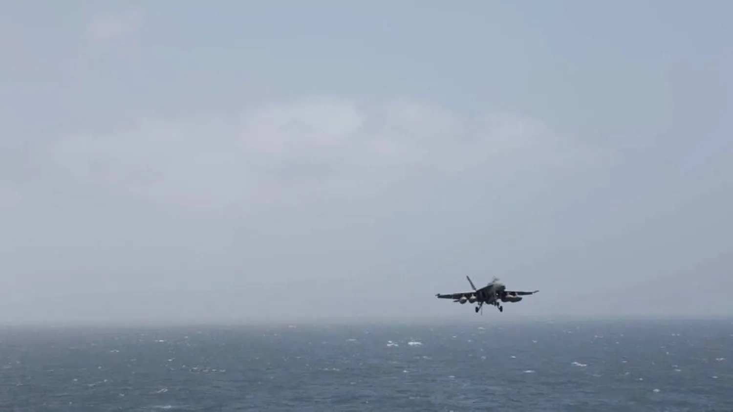 An aircraft prepares to land aboard the USS George H.W. Bush, at an unknown location, released July 14, 2026, in this still image taken from a handout video. US Central Command (CENTCOM)/Handout via Reuters