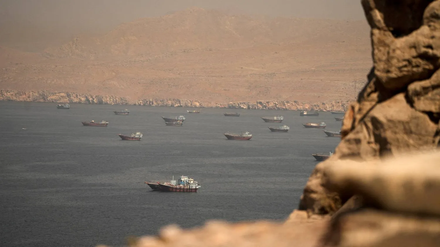 FILE PHOTO: Vessels at the Strait of Hormuz, as seen from Musandam, Oman, June 18, 2026. REUTERS/Stringer/File Photo
