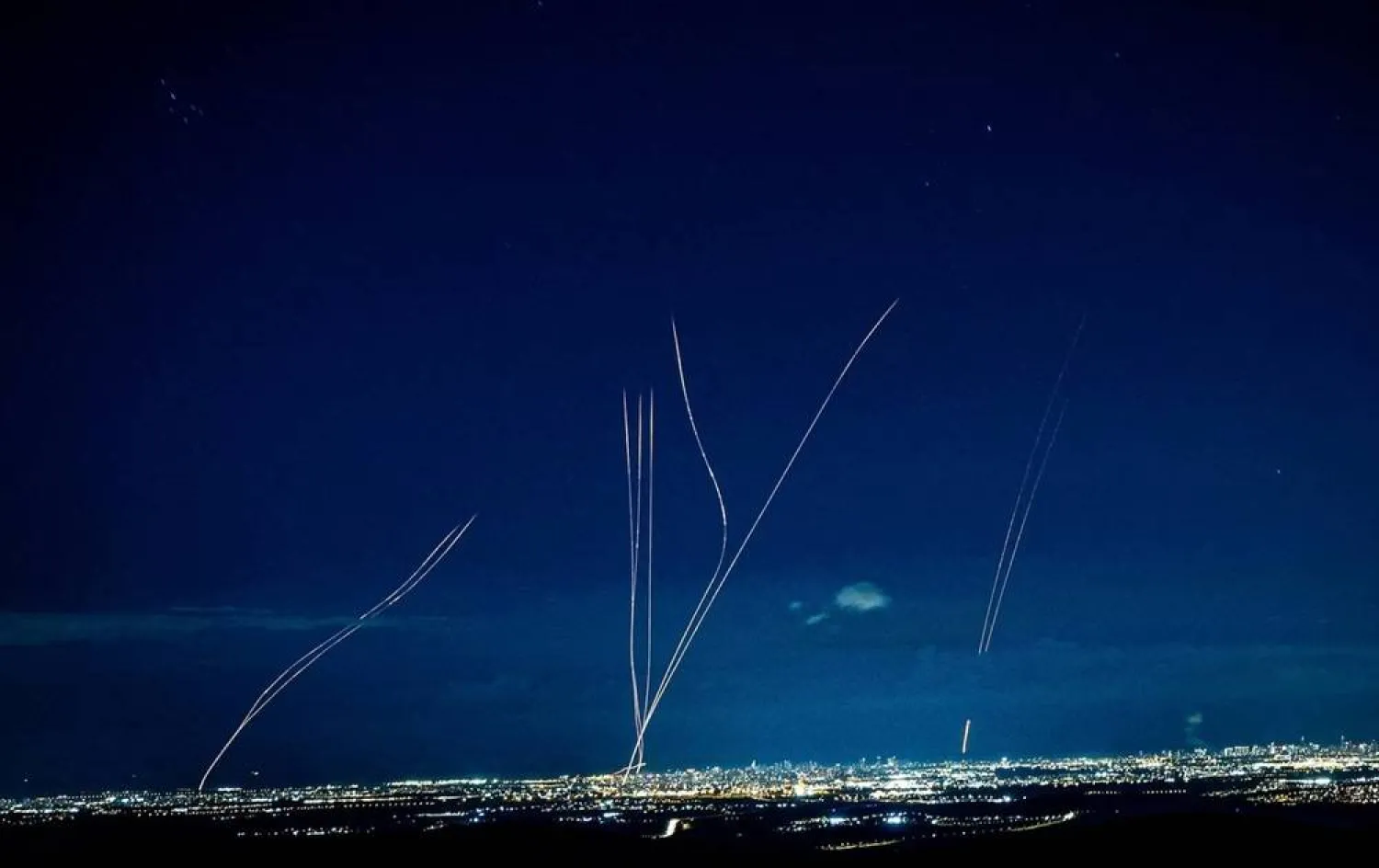 Interceptors rise into the sky after Iran launched missiles into Israel, as seen from central Israel, February 28, 2026. (Reuters)