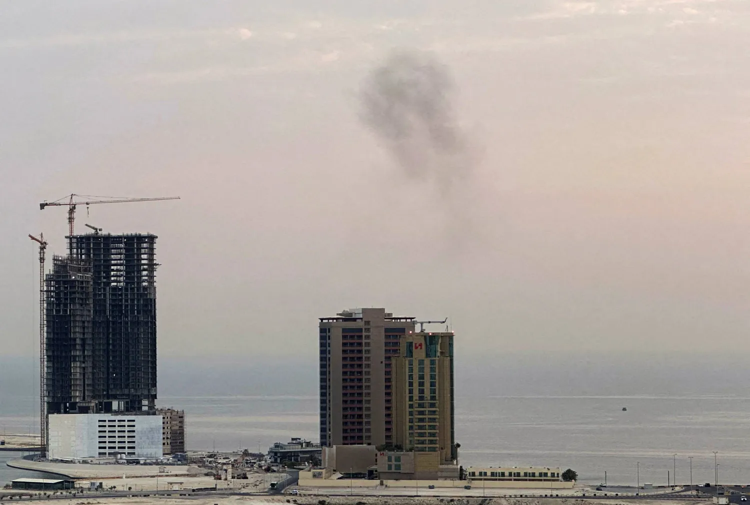 Smoke rises after a drone was intercepted during early morning hours in Manama, Bahrain, July 14, 2026. REUTERS/Stringer