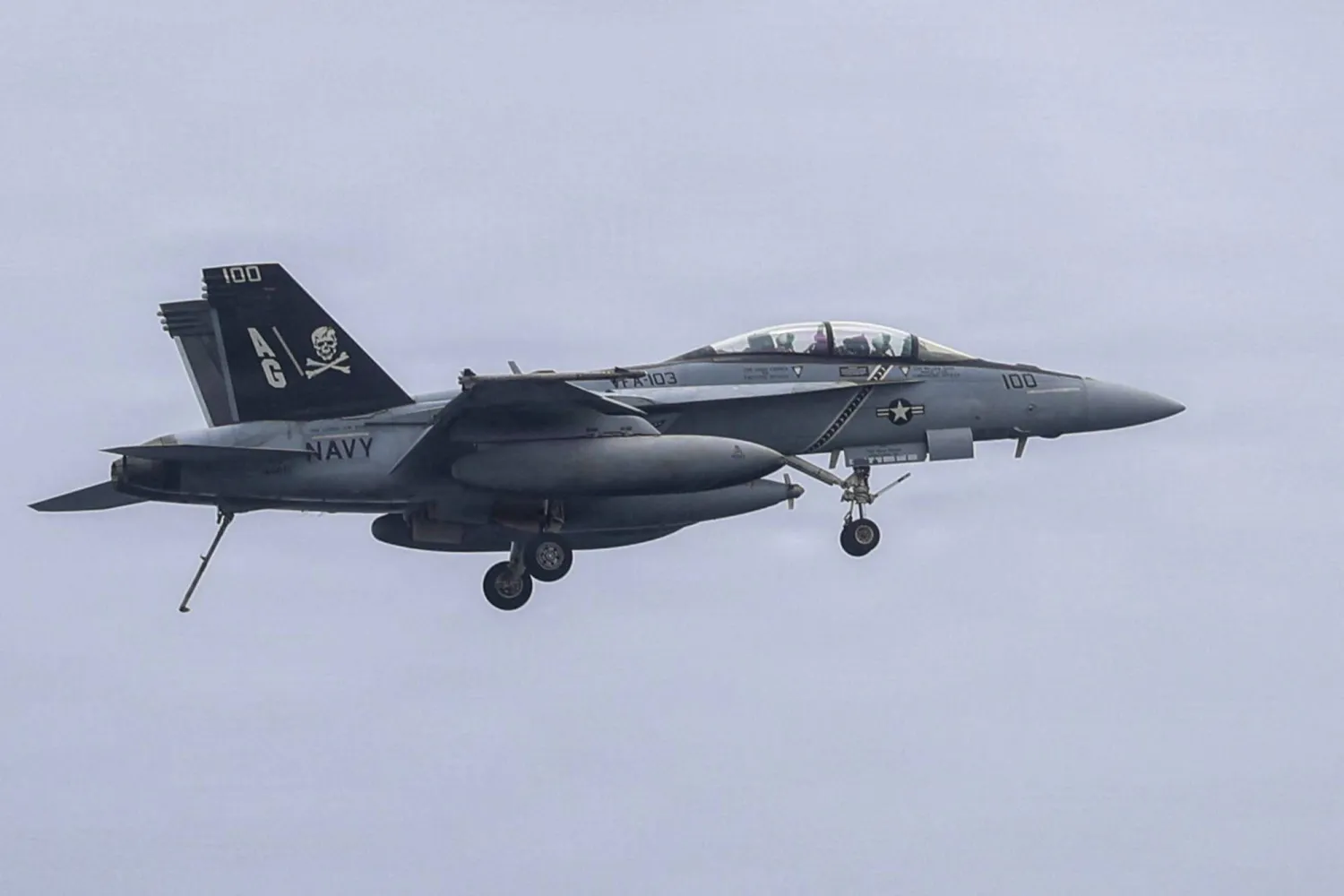 This US Navy handout photo released on July 10, 2026 and taken on June 29 by US Central Command Public Affairs shows an F/A-18F Super Hornet, attached to Strike Fighter Squadron (VFA) 103, preparing to land on the flight deck of Nimitz-class aircraft carrier USS George H.W. Bush (CVN 77). (US Navy/AFP)