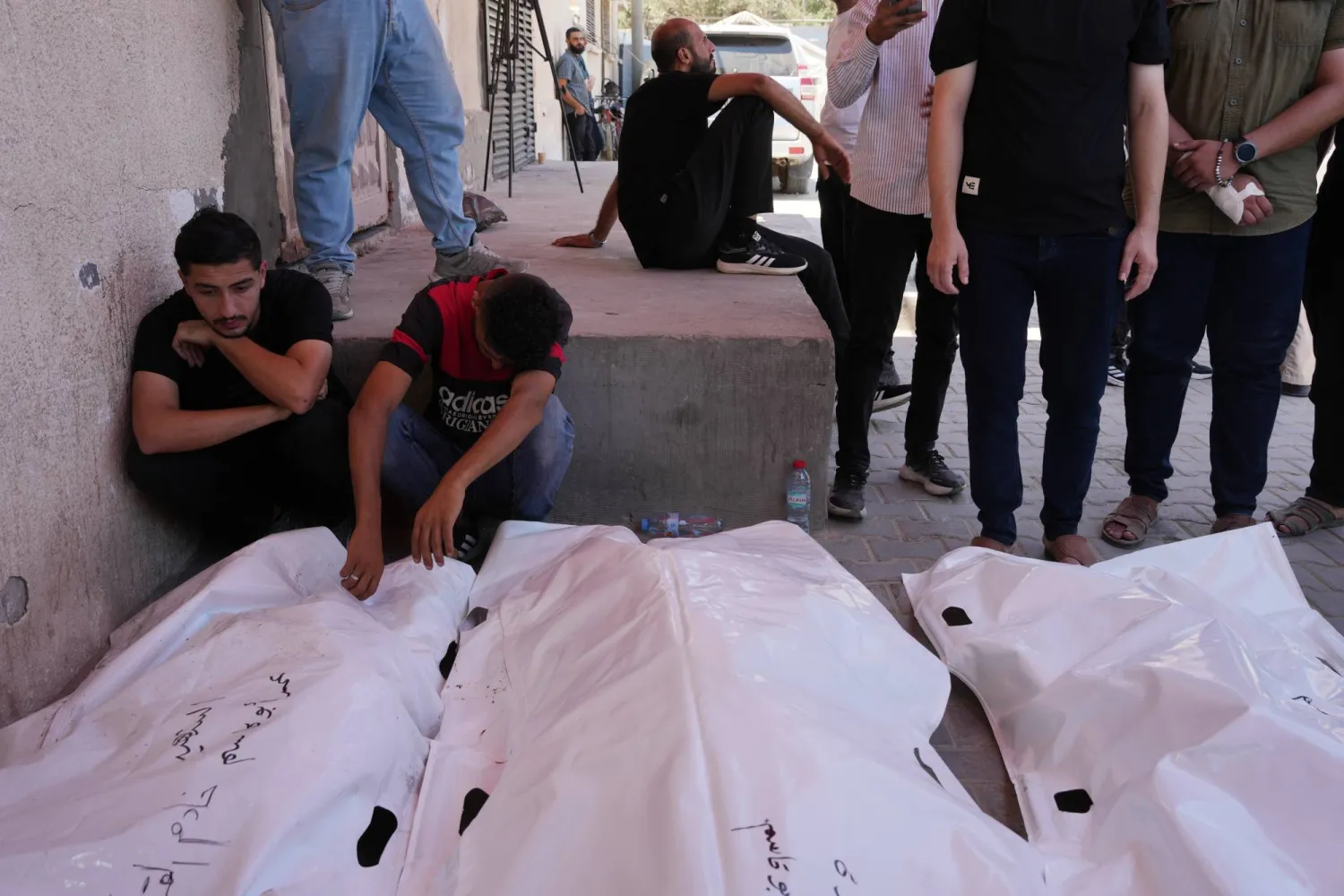 Palestinians mourn victims killed in an Israeli strike on a residential building in central Gaza on Wednesday. (AP)