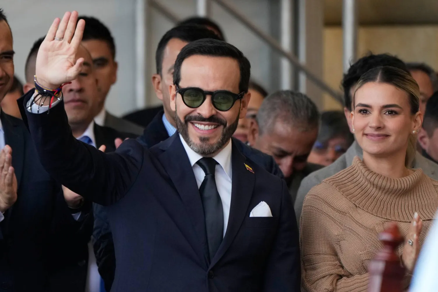 Colombian President-elect Abelardo de la Espriella, left, waves to supporters next to his wife Ana Lucia Pineda in Chiquinquira, Colombia, Thursday, July 9, 2026. (AP Photo/Fernando Vergara)
