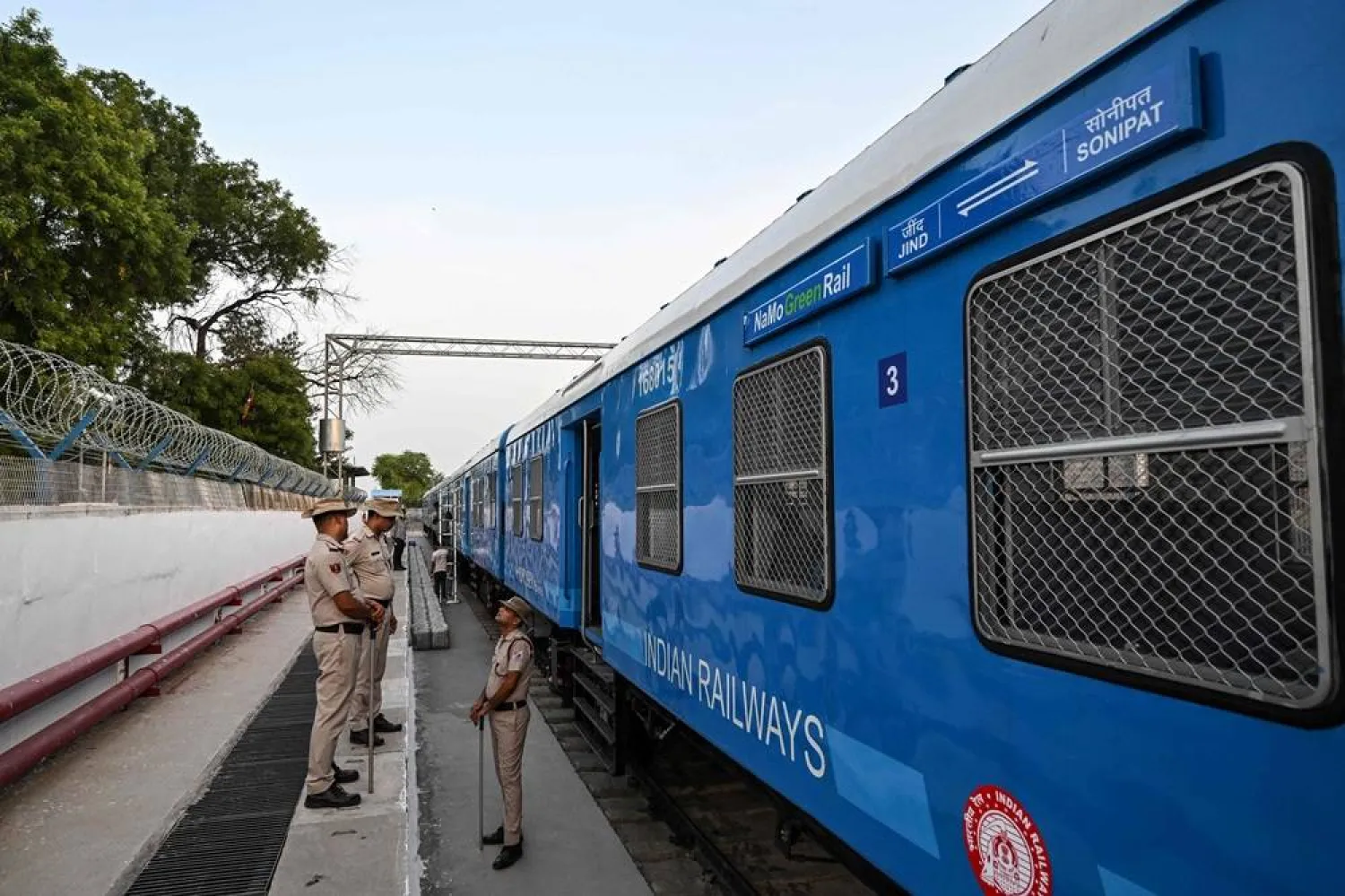 India's Railway Protection Special Force (RPSF) personnel stand guard near the hydrogen-powered train at a depot ahead of its launch in Haryana's Jind on July 16, 2026. (AFP)