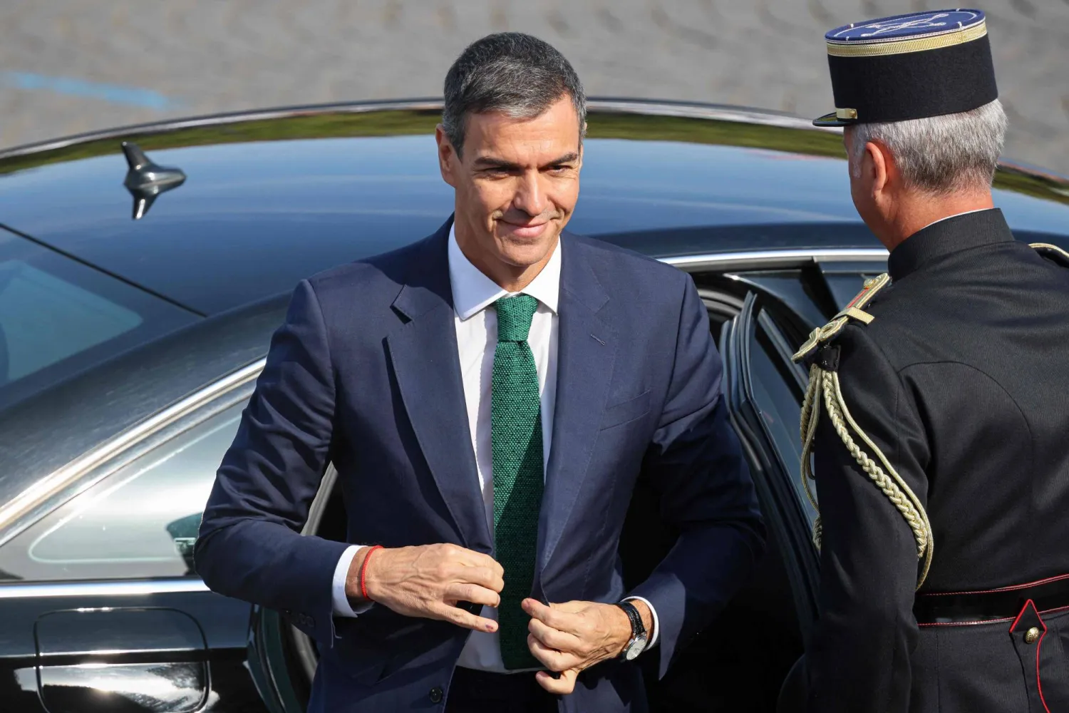 Spain's Prime Minister Pedro Sanchez arrives for the annual Bastille Day military parade on the Champs-Elysees Avenue in Paris on July 14, 2026. (Photo by Ludovic MARIN / AFP)