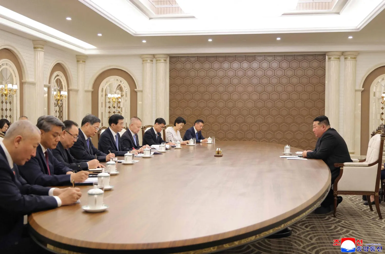 This picture taken on July 16, 2026 and released by North Korea's official Korean Central News Agency (KCNA) via KNS on July 17, 2026 shows North Korean leader Kim Jong Un (R) speaking to the Chinese government delegation headed by Wang Huning, member of the Standing Committee of the Political Bureau of the Central Committee of the Communist Party of China and chairman of the National Committee of the Chinese People's Political Consultative Conference, in Pyongyang. (KCNA vis KNS / AFP) 