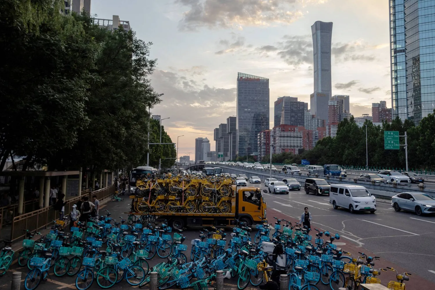 FILE PHOTO: A truck loaded with bicycles drives out of a collection area for shared bicycles near Beijing's Central Business District (CBD), China, July 6, 2026. REUTERS/Maxim Shemetov/File Photo/File Photo