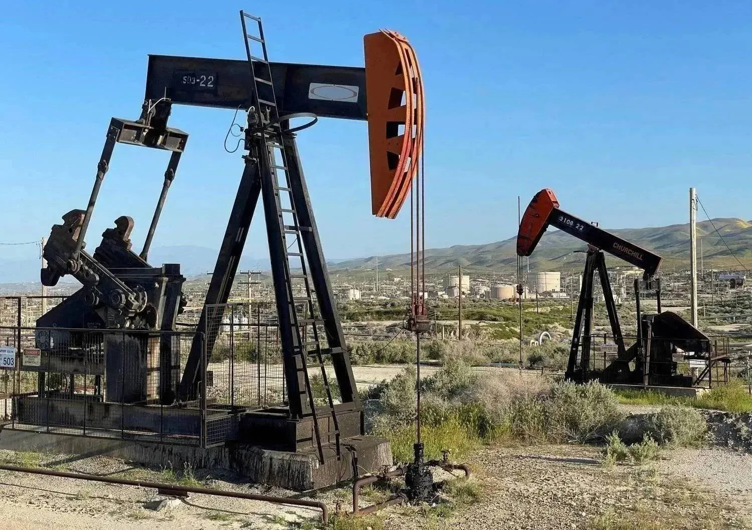 Drills operate in an oil field in California (Reuters)