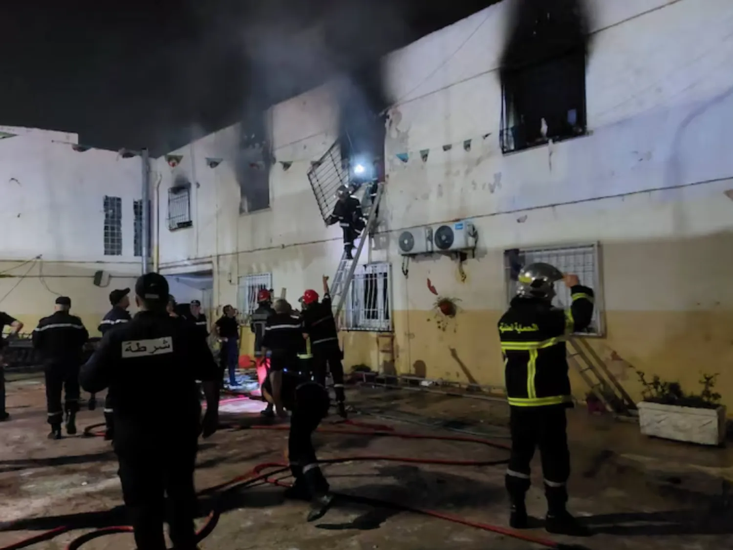 Rescuers and police officers work at the site of a fire at an orphanage near Algiers, Algeria, July 16, 2026. Algerian Civil Protection/Handout via REUTERS