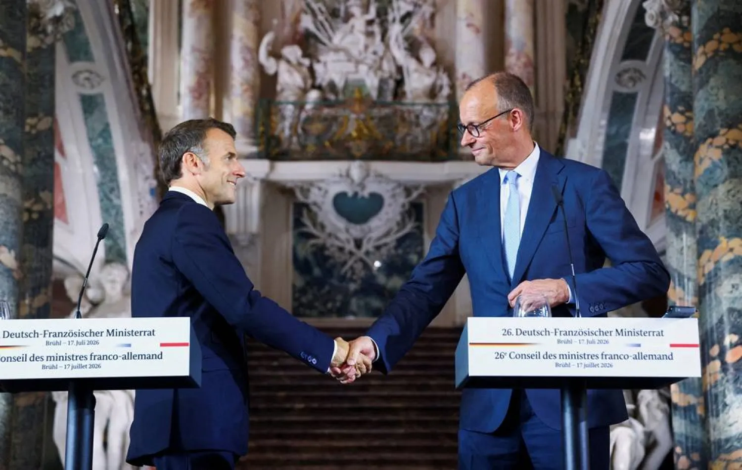  German Chancellor Friedrich Merz and French President Emmanuel Macron shake hands after a press conference at Schloss Augustusburg in Bruehl, Germany, July 17, 2026. (Reuters)