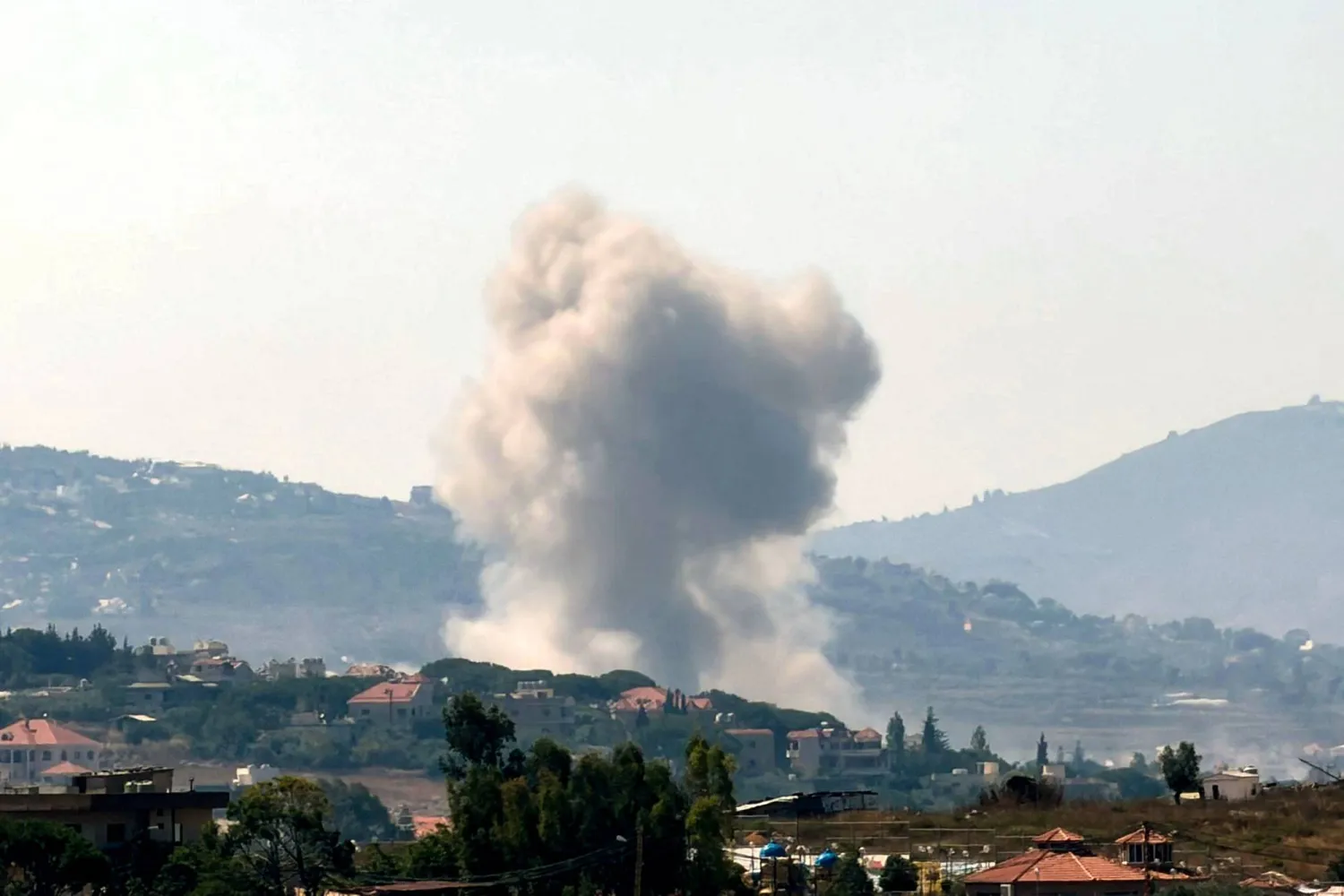 This photograph taken from the southern Lebanese city of Nabatieh shows smoke as it rises from the site of an Israeli-controlled explosion in the village of Kfar Tebnit on July 18, 2026. (Photo by Abbas FAKIH / AFP)