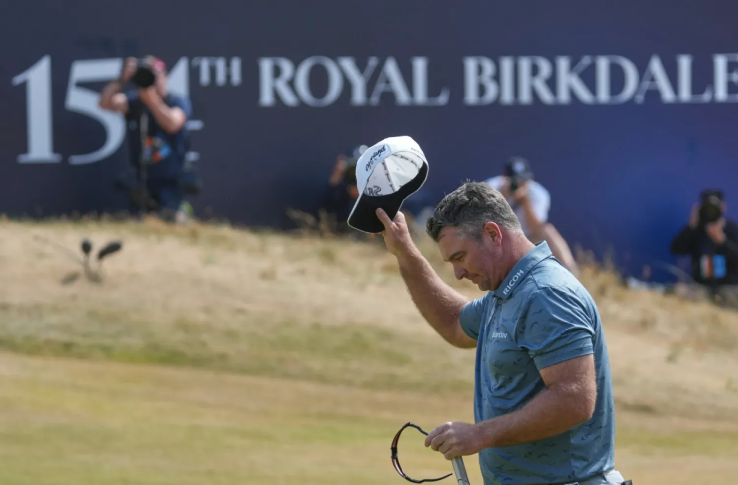 Ryan Fox of New Zealand acknowledges the crowd on the 188th green after completing his third round during the third day of the British Open Golf championships at Royal Birkdale golf club, in Southport, England, Saturday, July 18, 2026. (AP Photo/Jon Super)