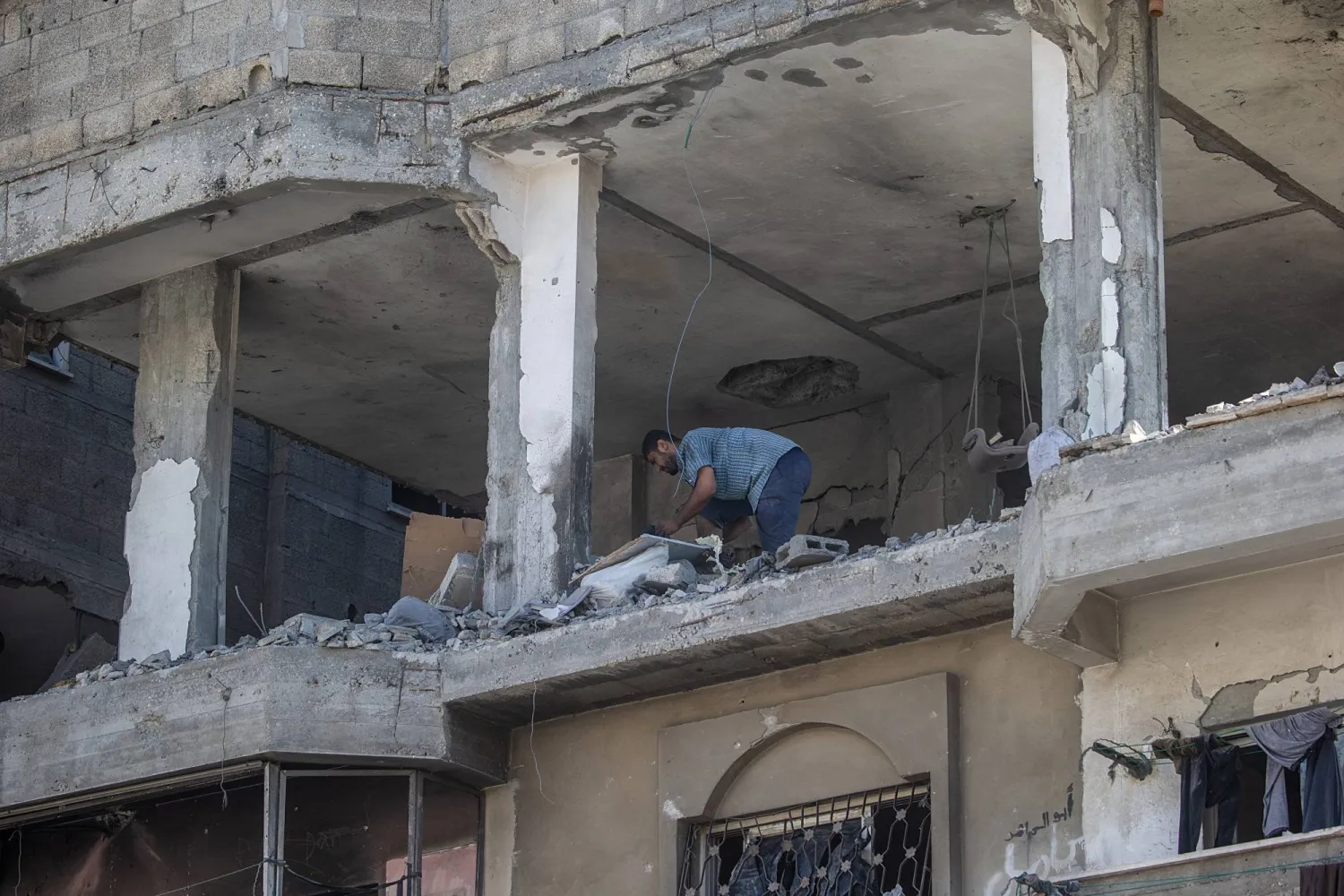 A Palestinian inspects a house destroyed in an Israeli airstrike in northern Gaza City, Gaza Strip, 18 July 2026. EPA/MOHAMMED SABER